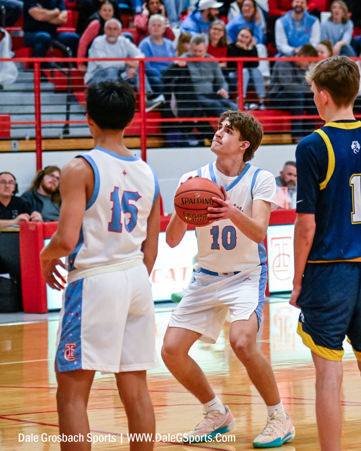 Trinity Catholic boys hold off Central Christian rally for 50-46 victory