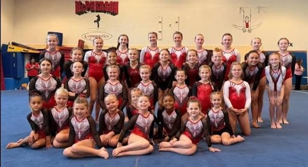 McPherson Gym Pups Shine at JAG Invite